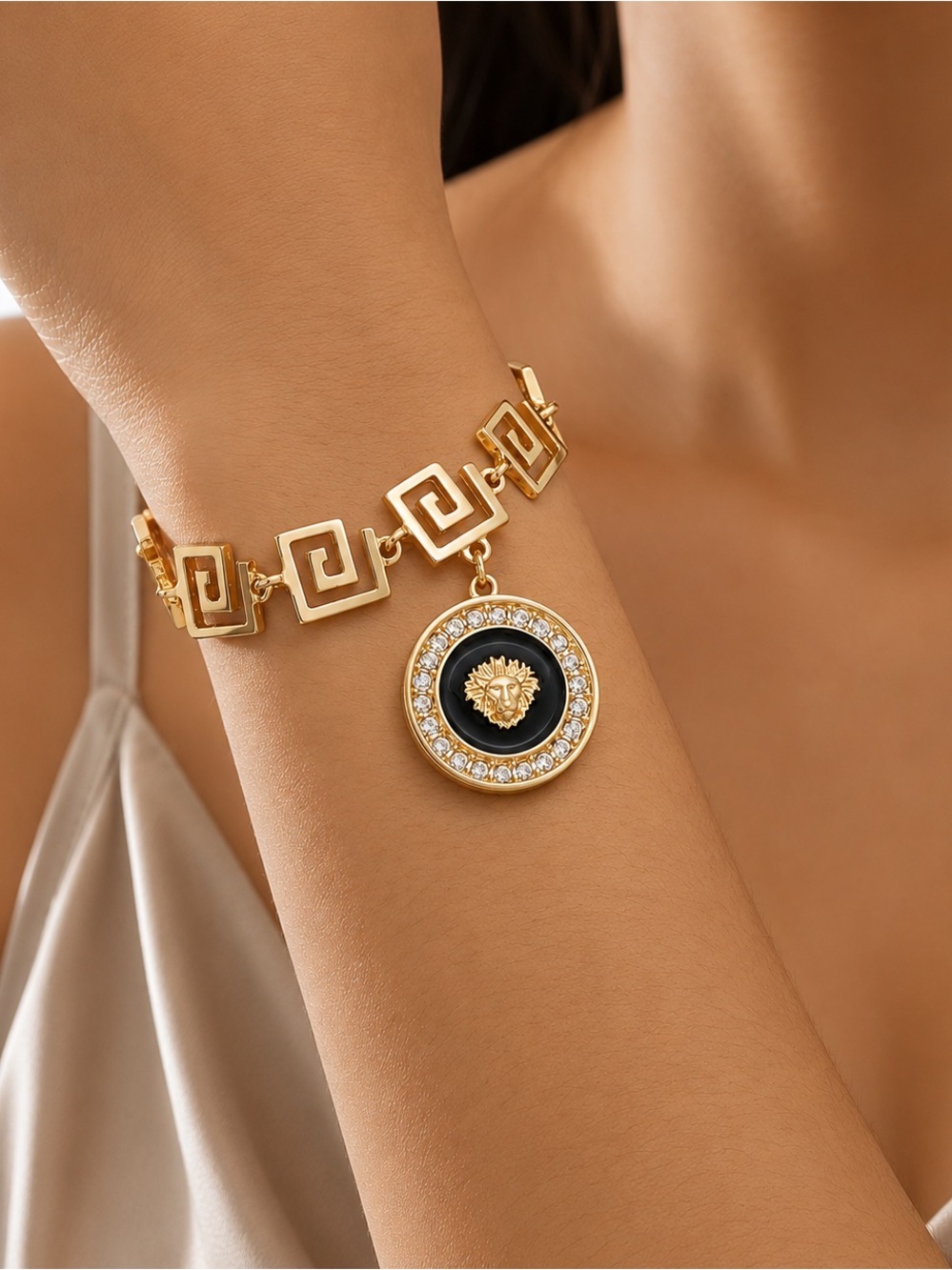 Gold-tone Medallion Link Bracelet with Black Enamel